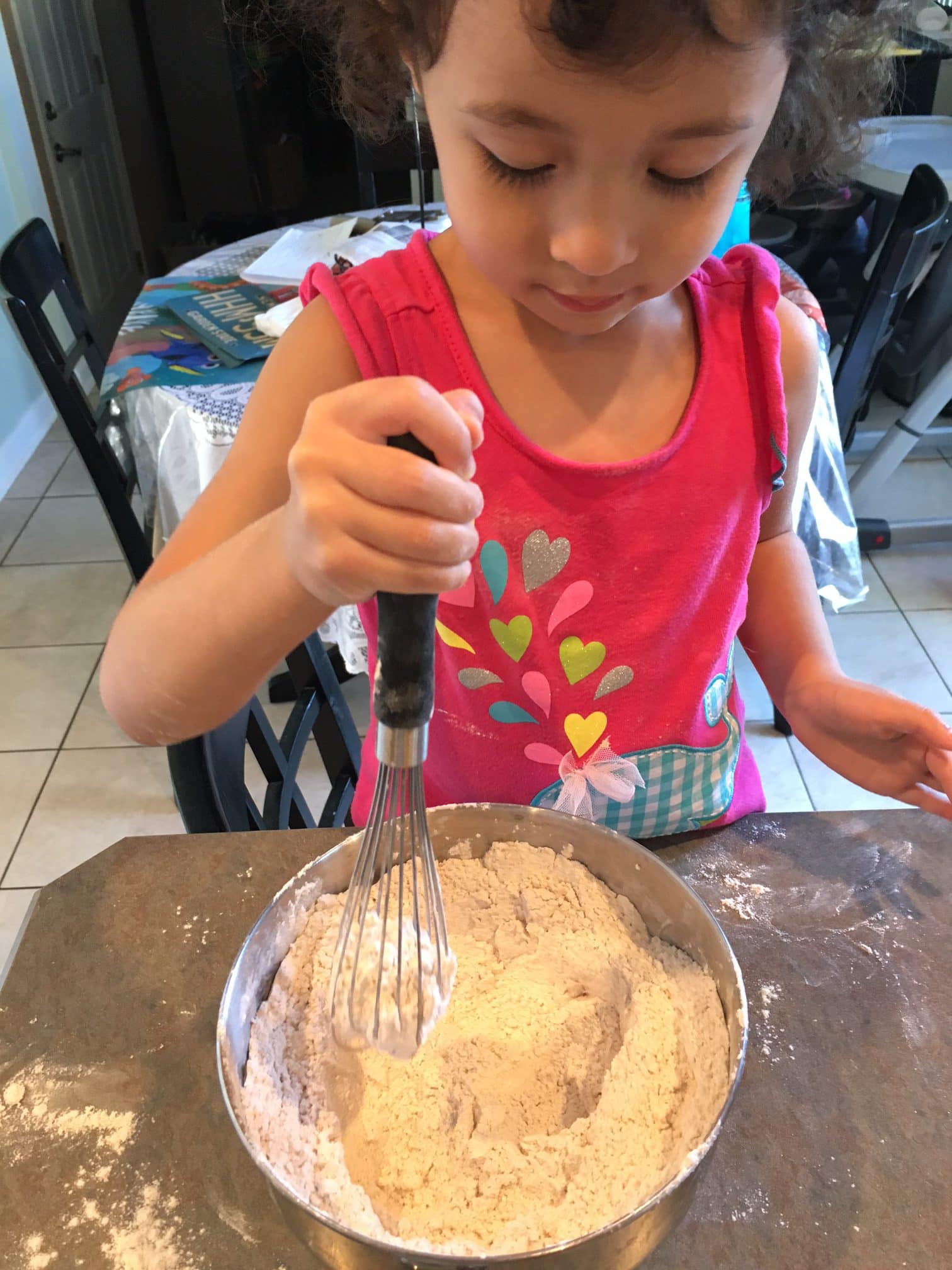 sifting zucchini bread ingredients