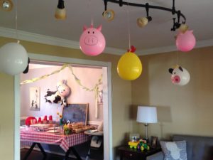 diy farm themed party with farm animal balloons