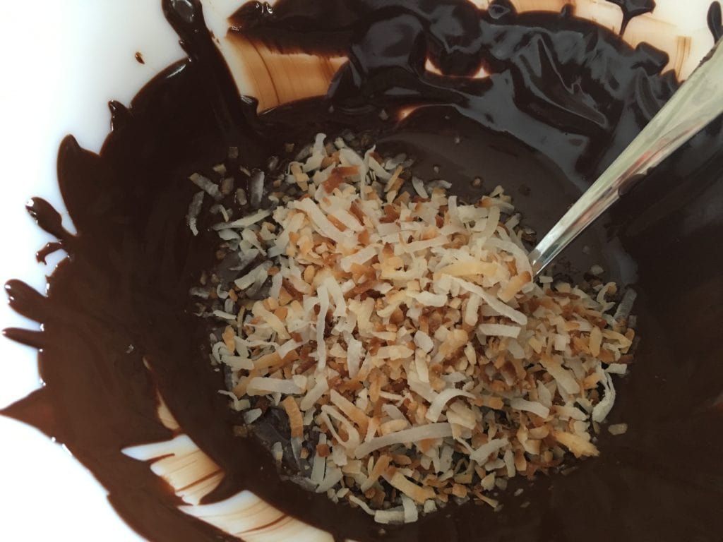 adding coconut to chocolate