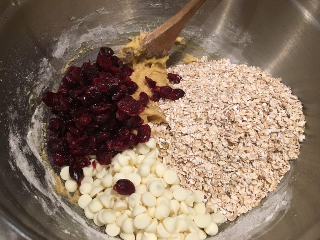 adding white chocoate, oatmeal, cranberries