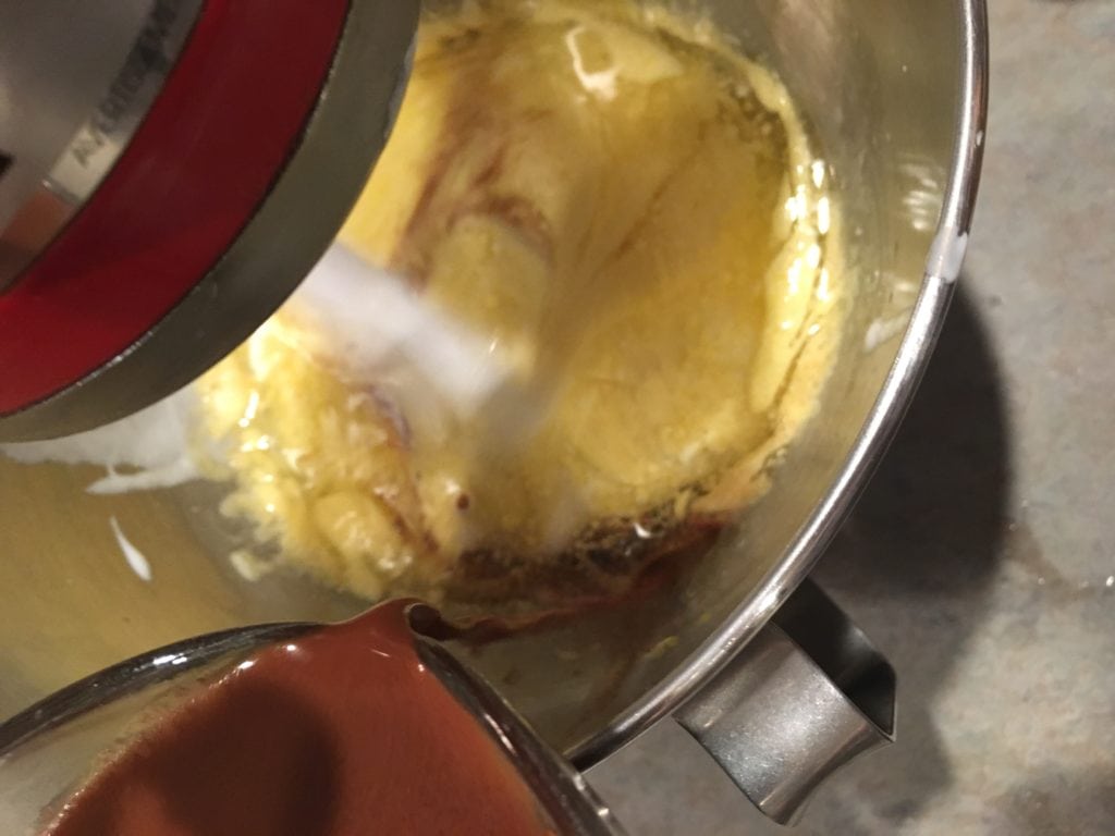 adding dry ingredients for moist chocolate cake